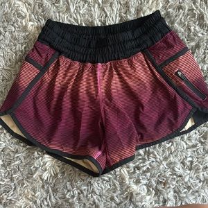 RARE Lululemon black/red/orange TRACKERS 4" (no longer made)